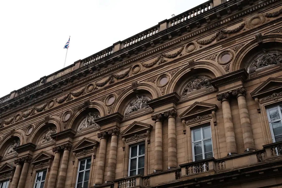 Ornate stone facade of the former Free Trade Hall on Peter Street in a Manchester city centre conservation area